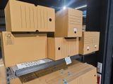 many boxes stacked on top of each other in a warehouse