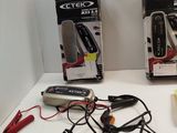 two boxes of electric tools on a table