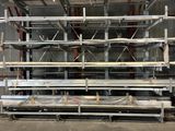 a large metal rack with lots of shelves in a warehouse