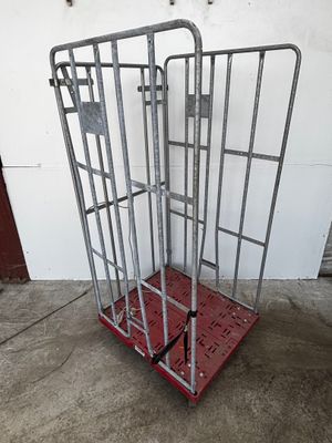 a metal cage that is sitting on top of a red platform