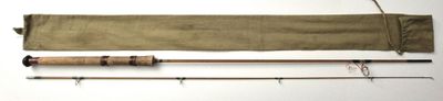 two fishing rods and a fishing rod on a white surface