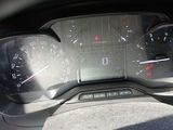 a close up of a car dashboard with a speedometer and gauges