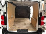 a white van with the back door open and the back of the van is empty
