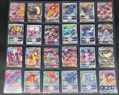 gros plan d'une collection de cartes pokemon sur une table