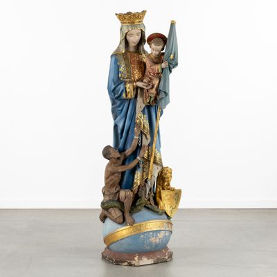 an image of a statue of a woman holding a child