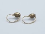 a pair of gold earrings on a white background