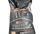 a bag of dog food sitting on a white surface