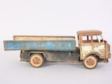 a toy truck that is sitting on a white surface