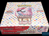 a box of pokemon trading cards on a black background