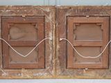 two old wooden doors that have been painted brown