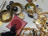 a pile of assorted jewelry on a table