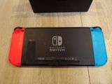 two nintendo switch cases sitting next to each other on a table