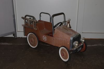 a small toy car that is sitting on the floor