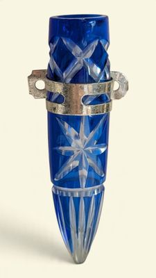 a blue glass vase with a star design on it