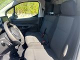 the interior of a small van with the front seats folded down