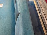 a blue suitcase sitting on top of a blue chair