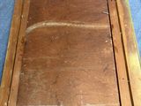 a picture of an old wooden picture frame on the floor