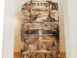 an open book with a picture of a chair in it on a table