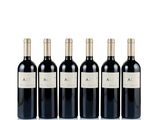 four bottles of red wine are lined up in a row