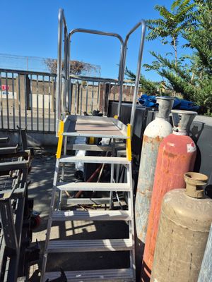 a ladder that is next to a fire hydrant and a fire hydrant
