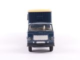 a toy truck that is sitting on a white surface