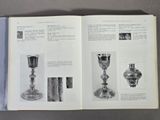 an open book with pictures of silverware on it