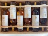 many bottles of wine sitting in a wooden box