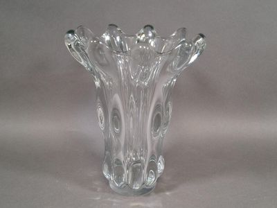 a glass vase that is sitting on a table