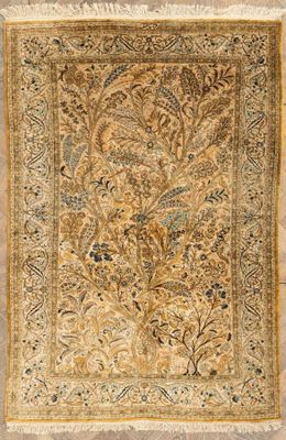 an antique persian rug with a floral design on a beige ground