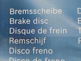 a sign on the side of a building that says brake disc