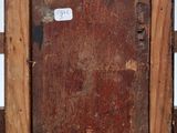 an old wooden picture frame with a piece of wood sticking out of it