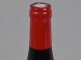 a bottle of wine that is sitting on a table