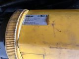 a close up of a yellow and black machine