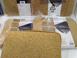 three pieces of cloth sitting on top of a table next to each other