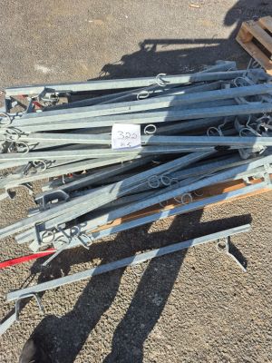 a pile of skis and ski poles on a pallet