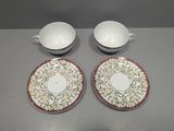 two bowls and a saucer are sitting on a table
