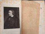 an old book with a picture of a man in a suit and tie