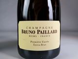 a bottle of champagne sitting on a table with a label on it