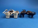 three pairs of women ' s shoes on a blue background