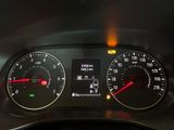 a close up of a car dashboard with a speedometer and gauges