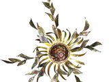 an image of a metal sunflower on a white background