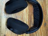 a pair of headphones sitting on a wooden table
