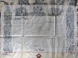 an old document with a cross on it on a table