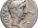gros plan d'une pièce de monnaie sur laquelle figure une tête d'homme