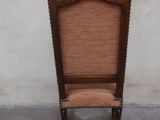 a chair that is sitting in front of a wall