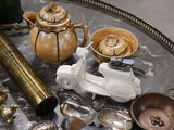 a tray with a lot of silver and gold items on it