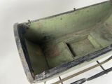 a small metal box with a handle on a metal stand