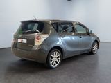 the back end of a silver toyota yaris parked in a room