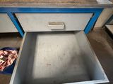 a drawer that is open on the floor