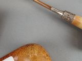a pipe and a pipe holder on a table